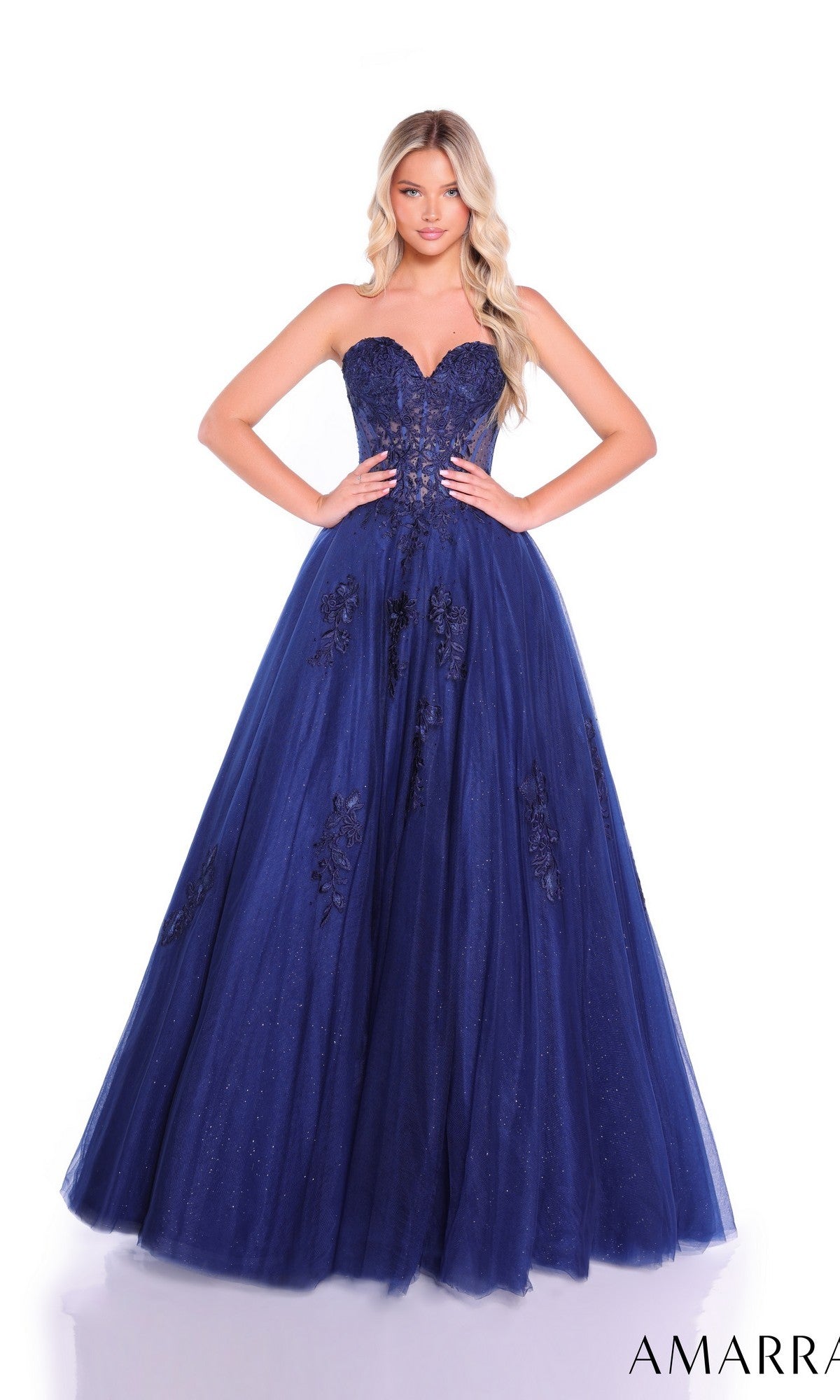 A woman poses in the Lace-Up Strapless Prom Ball Gown: Amarra 89011, featuring a sweetheart bodice with floral embellishments and a fitted silhouette, against a white background.